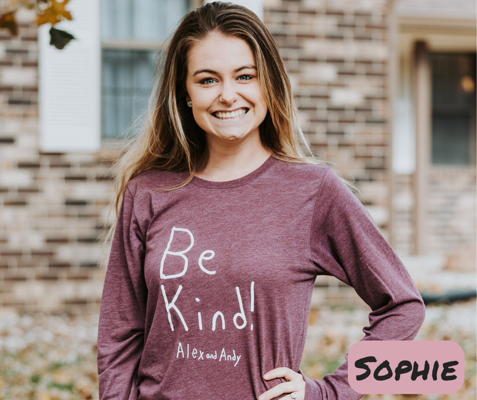 Sophie Wearing Be Kind Alex And Andy Long Sleeve Shirt